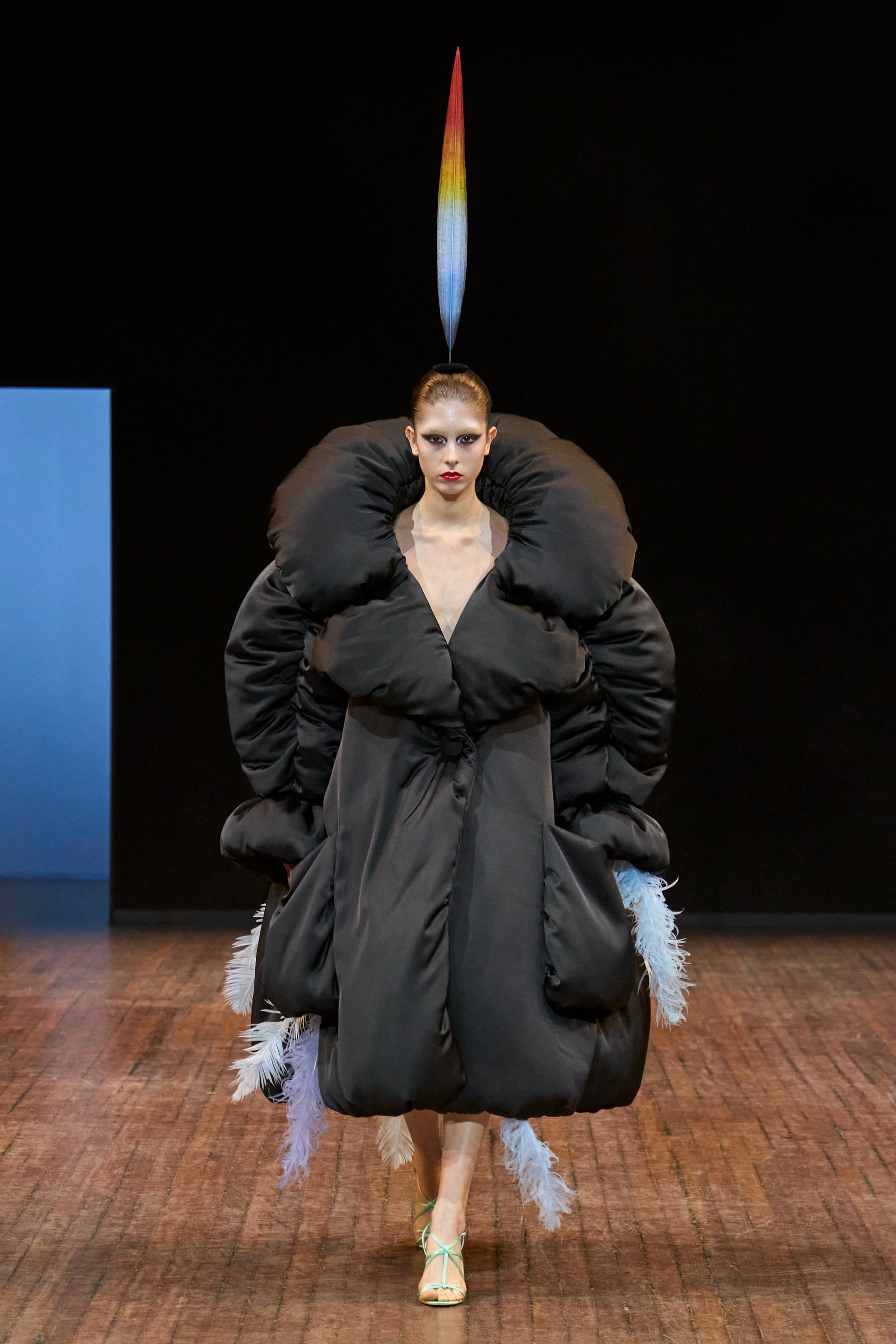 Viktor&Rolf Haute Couture Angry Birds show Autumn/Winter 2025, displaying one of the looks. The model is wearing a feather featured gown.
