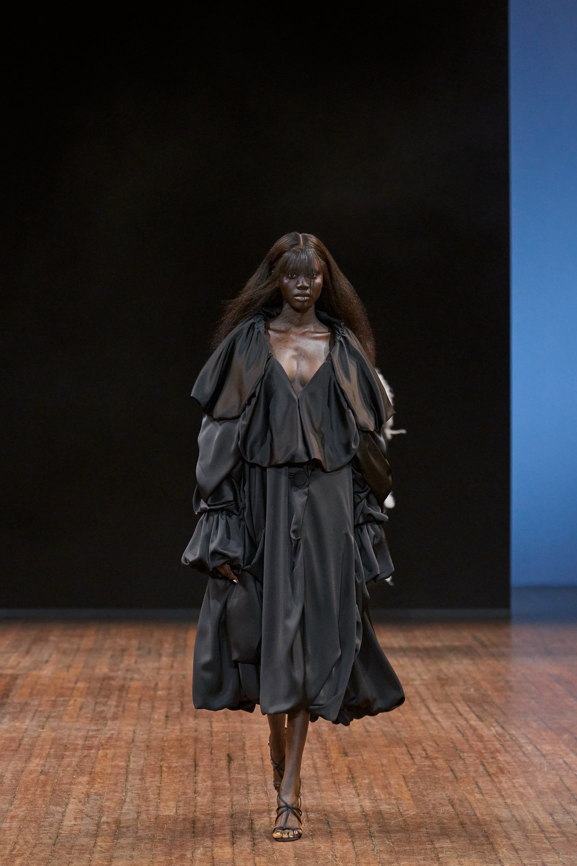 Viktor&Rolf Haute Couture Angry Birds show Autumn/Winter 2025, displaying one of the looks. The model is wearing a feather featured gowns.