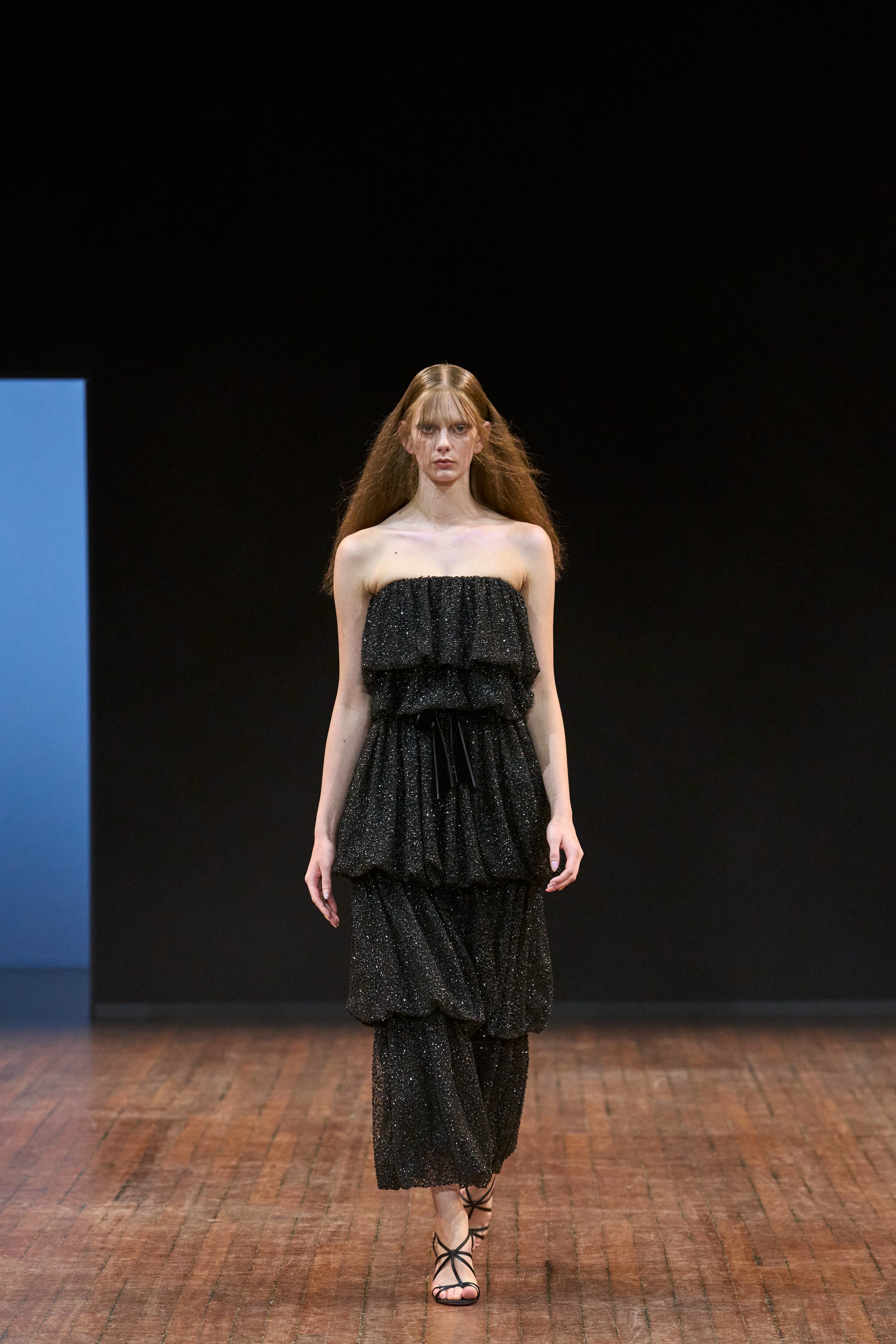 Viktor&Rolf Haute Couture Angry Birds show Autumn/Winter 2025, displaying one of the looks. The model is wearing a feather featured gown.