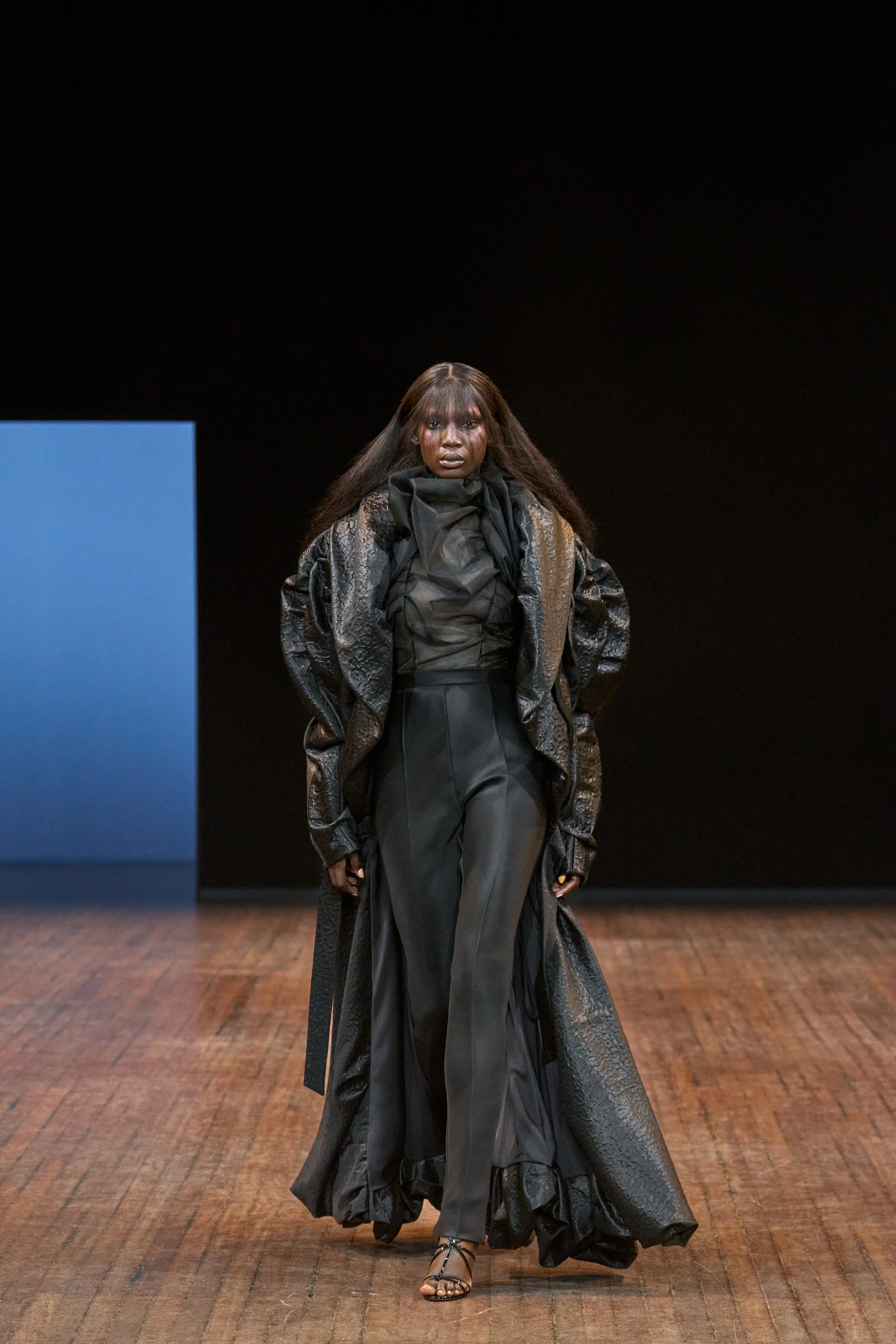 Viktor&Rolf Haute Couture Angry Birds show Autumn/Winter 2025, displaying one of the looks. The model is wearing a feather featured gown.
