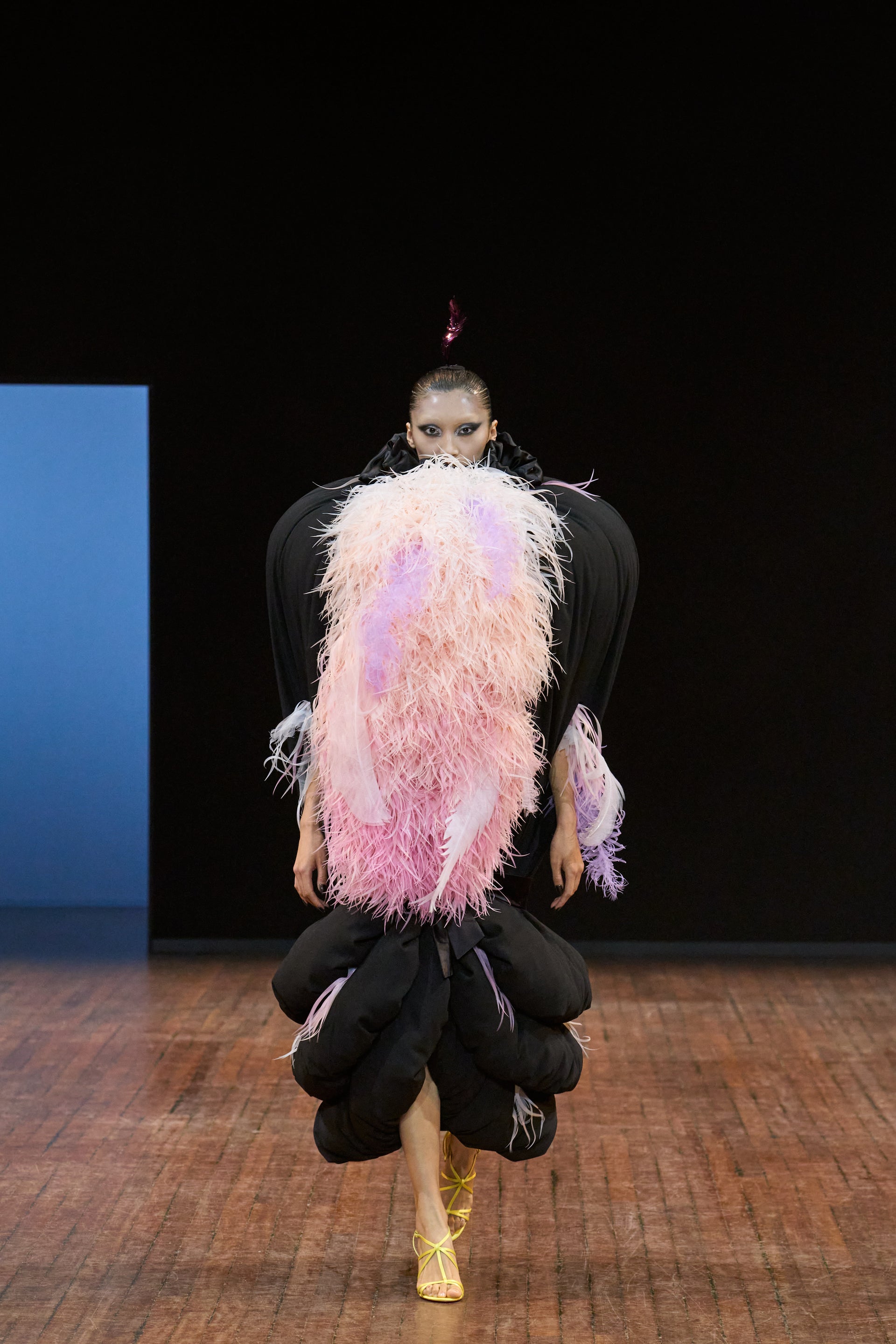 Viktor&Rolf Haute Couture Angry Birds show Autumn/Winter 2025, displaying one of the looks. The model is wearing a feather featured gown.