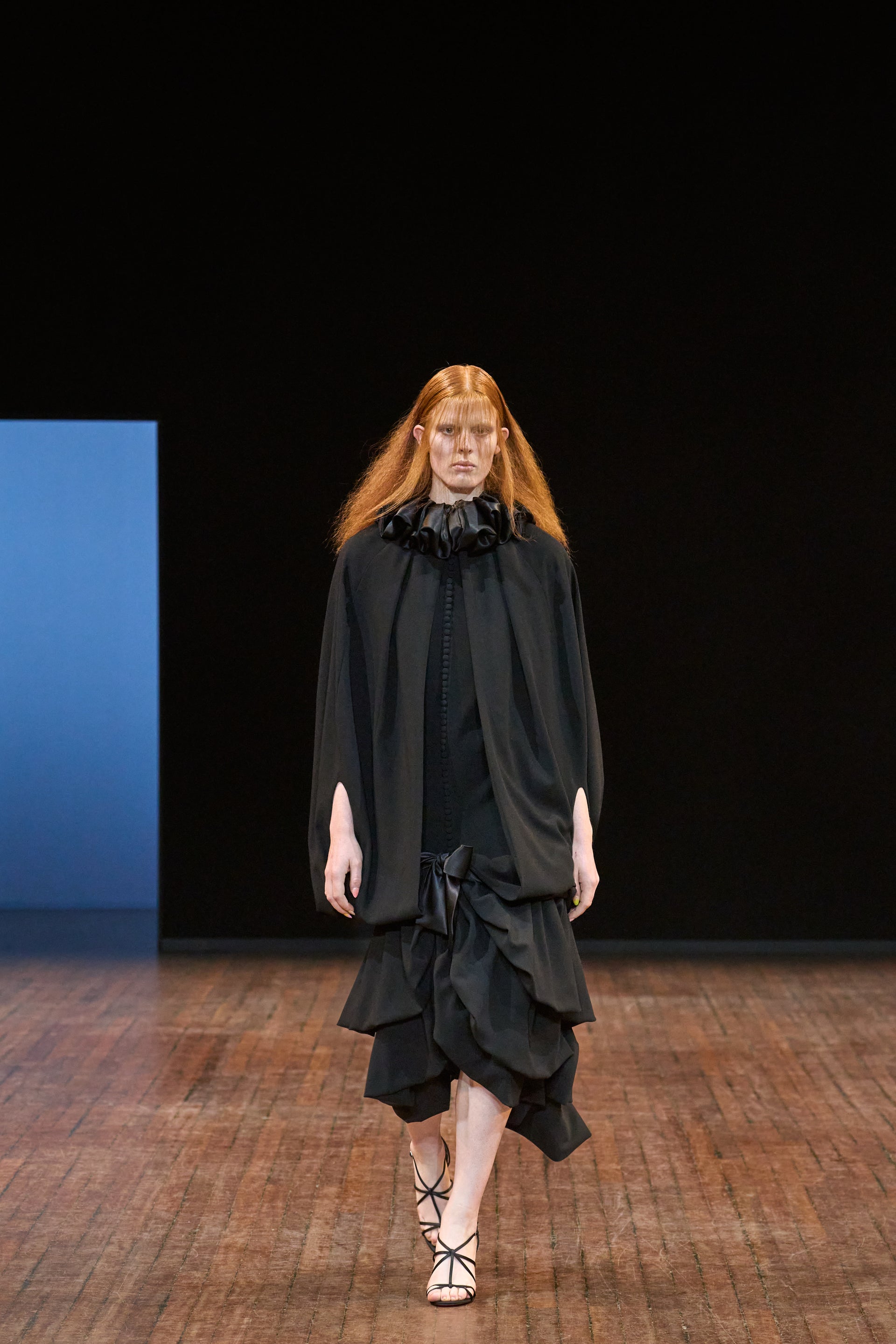 Viktor&Rolf Haute Couture Angry Birds show Autumn/Winter 2025, displaying one of the looks. The model is wearing a feather featured gown.