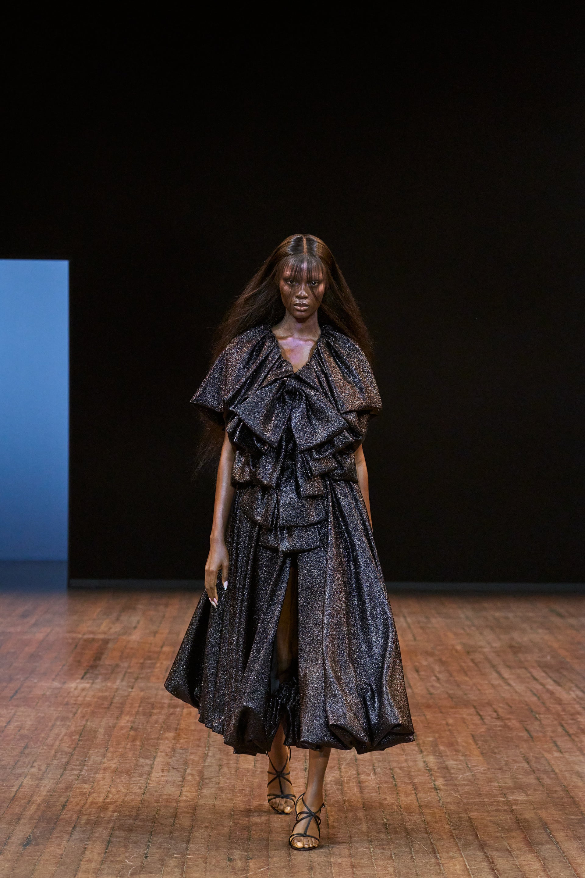 Viktor&Rolf Haute Couture Angry Birds show Autumn/Winter 2025, displaying one of the looks. The model is wearing a feather featured gown.