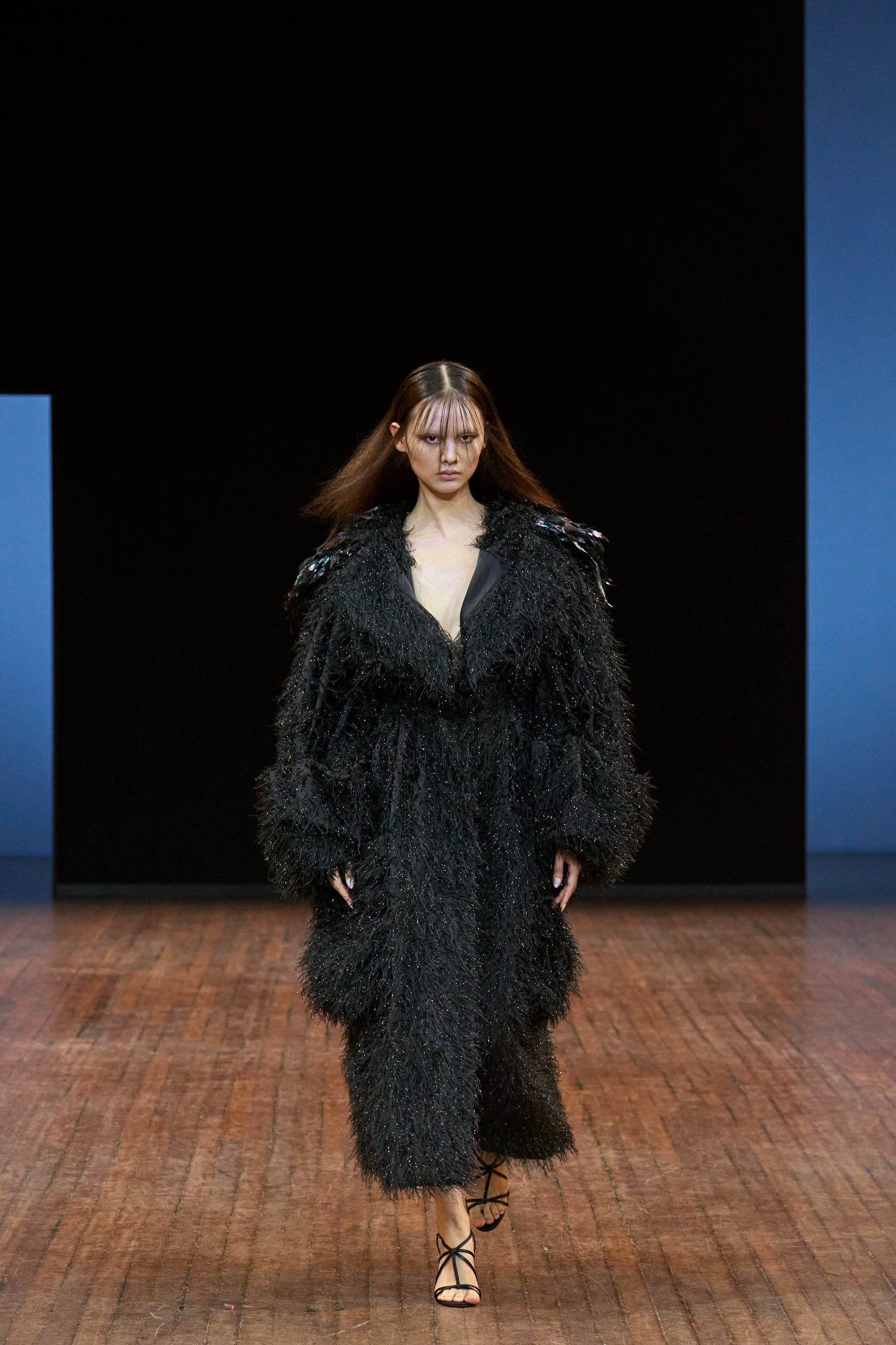 Viktor&Rolf Haute Couture Angry Birds show Autumn/Winter 2025, displaying one of the looks. The model is wearing a feather featured gown.