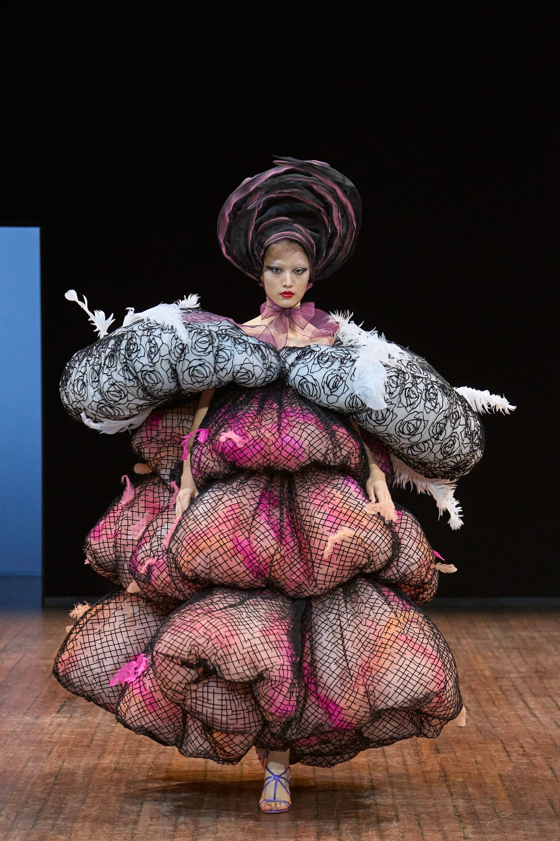 Viktor&Rolf Haute Couture Angry Birds show Autumn/Winter 2025, displaying one of the looks. The model is wearing a feather featured gown.