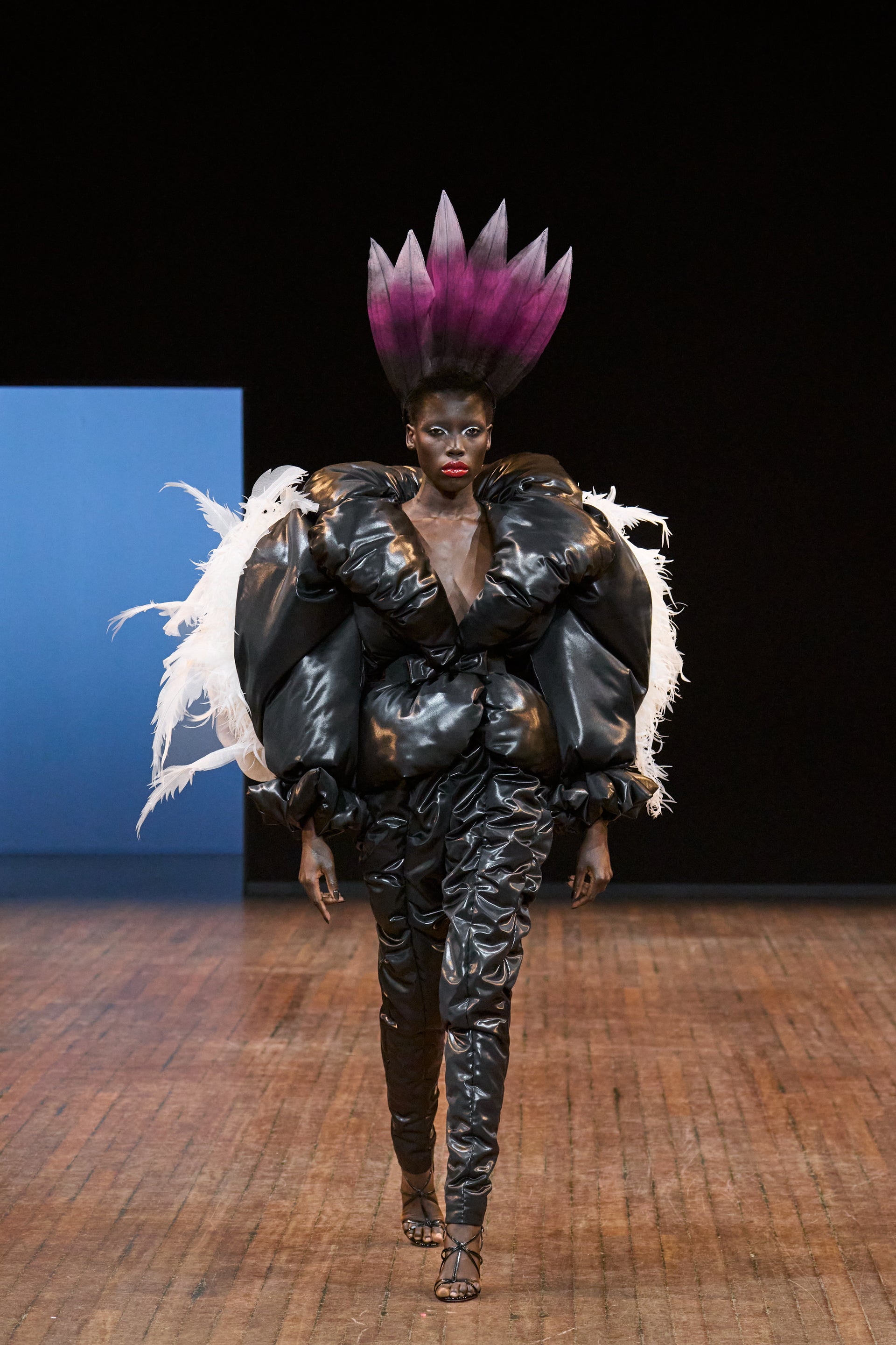 Viktor&Rolf Haute Couture Angry Birds show Autumn/Winter 2025, displaying one of the looks. The model is wearing a feather featured gown.