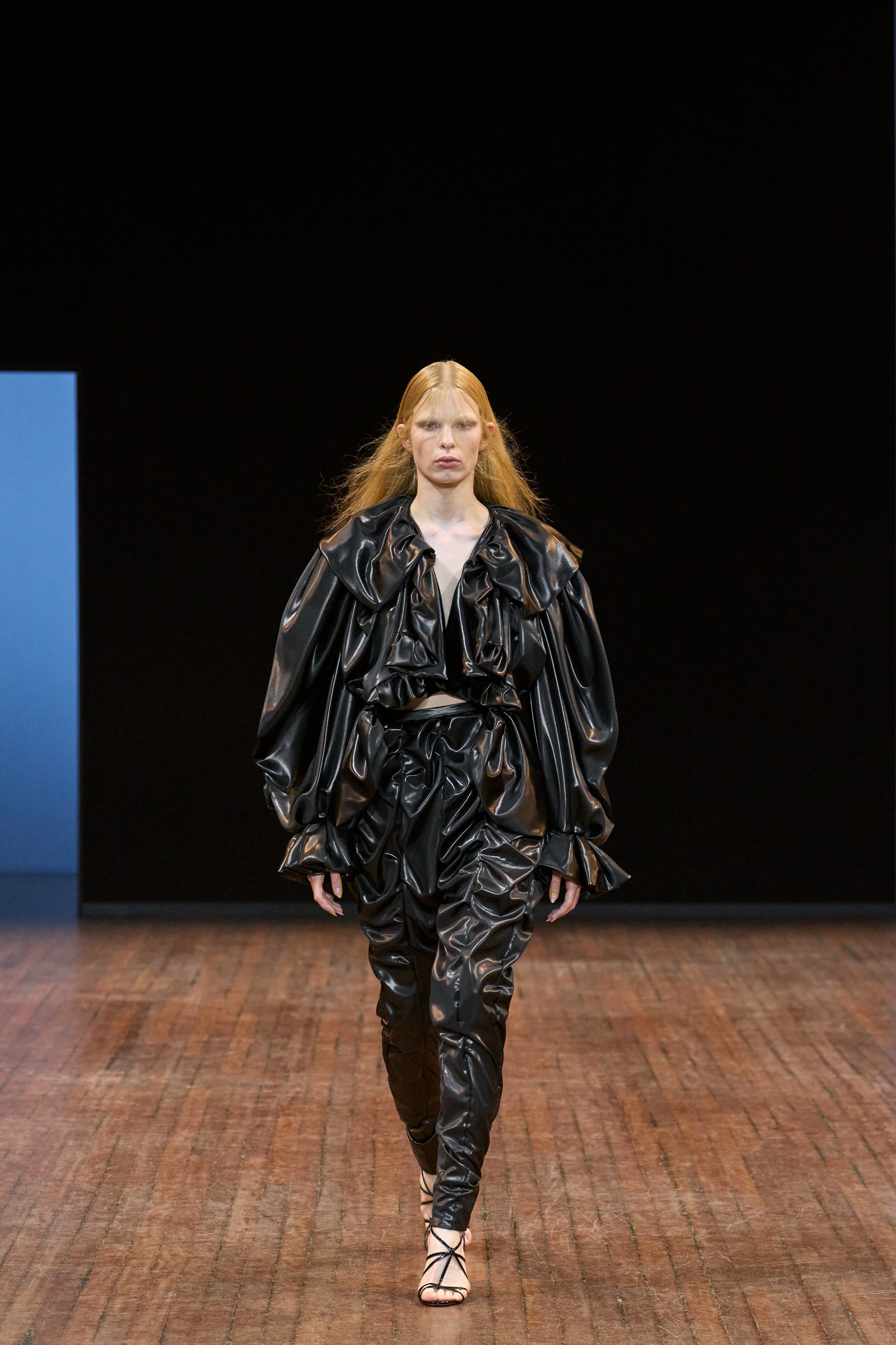 Viktor&Rolf Haute Couture Angry Birds show Autumn/Winter 2025, displaying one of the looks. The model is wearing a feather featured gown.