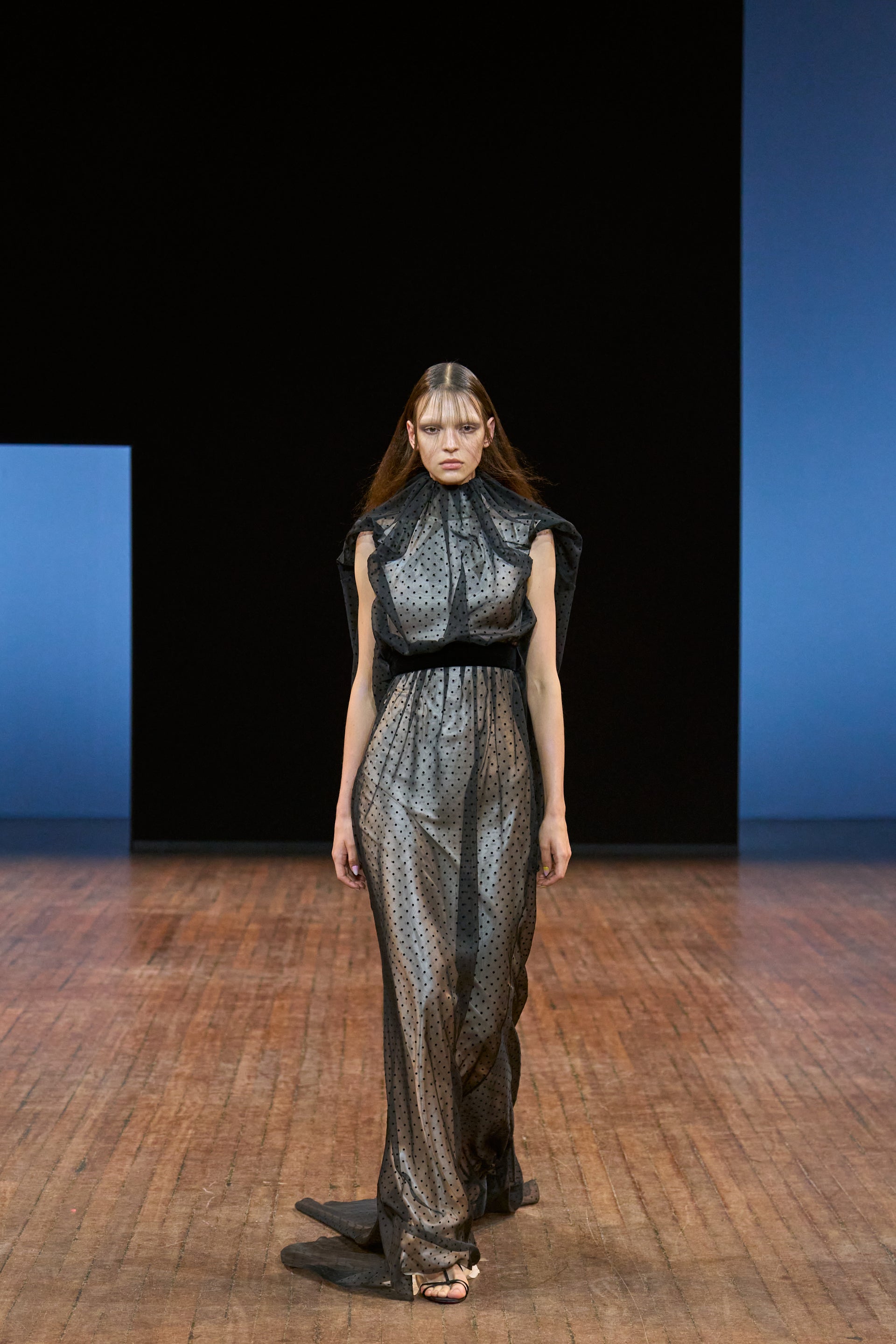 Viktor&Rolf Haute Couture Angry Birds show Autumn/Winter 2025, displaying one of the looks. The model is wearing a feather featured gown.