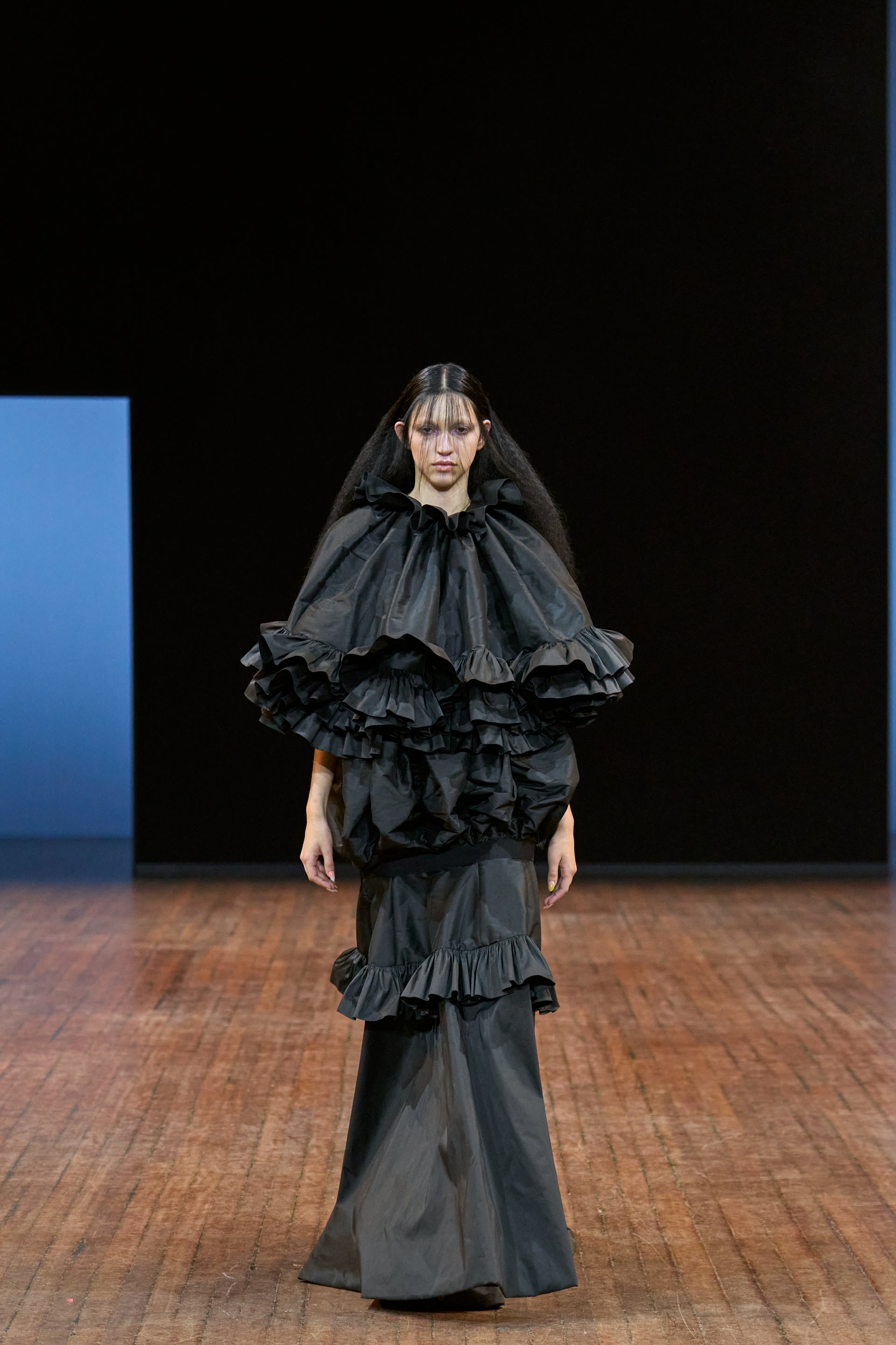 Viktor&Rolf Haute Couture Angry Birds show Autumn/Winter 2025, displaying one of the looks. The model is wearing a feather featured gown.