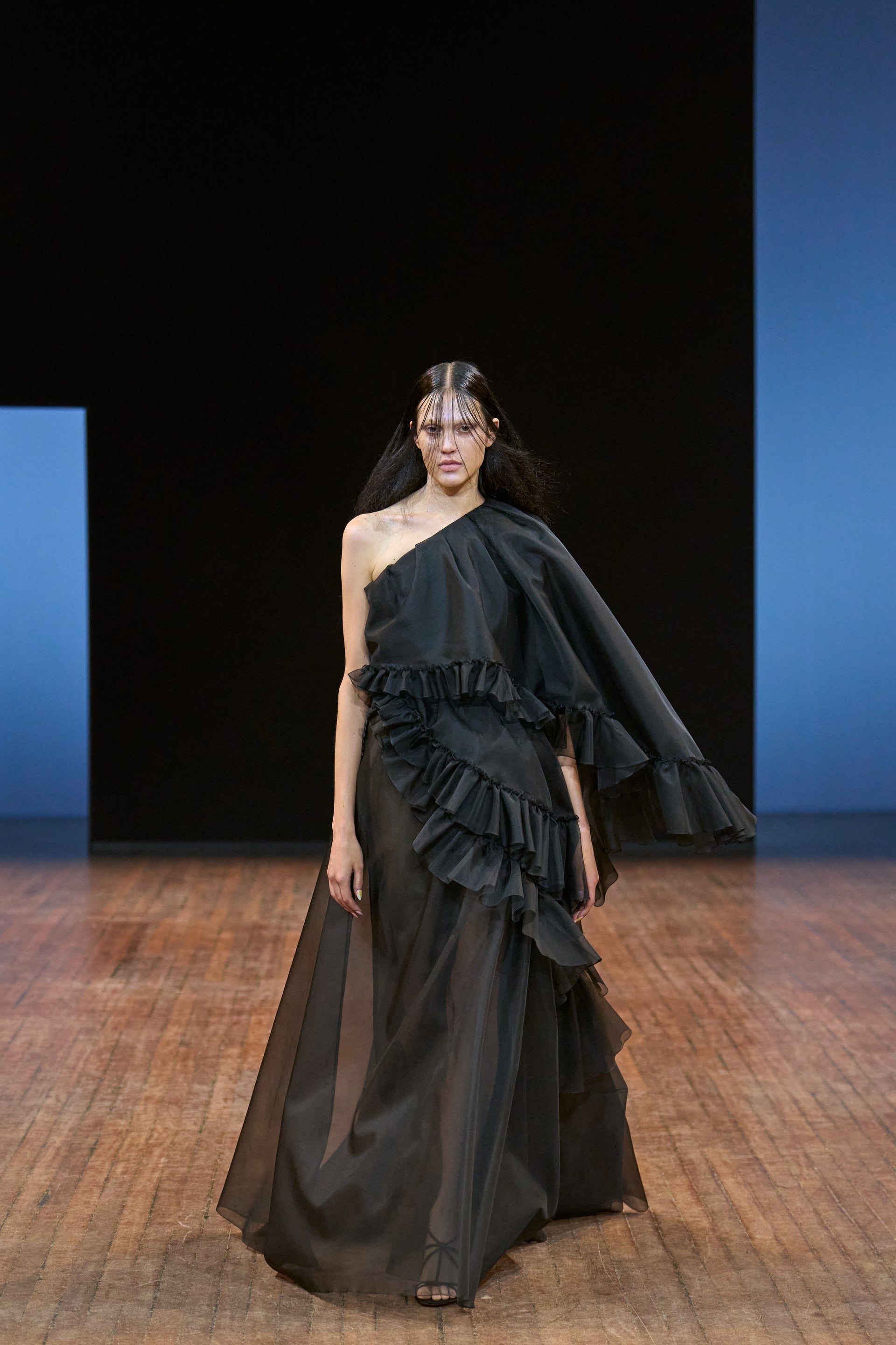 Viktor&Rolf Haute Couture Angry Birds show Autumn/Winter 2025, displaying one of the looks. The model is wearing a feather featured gown.