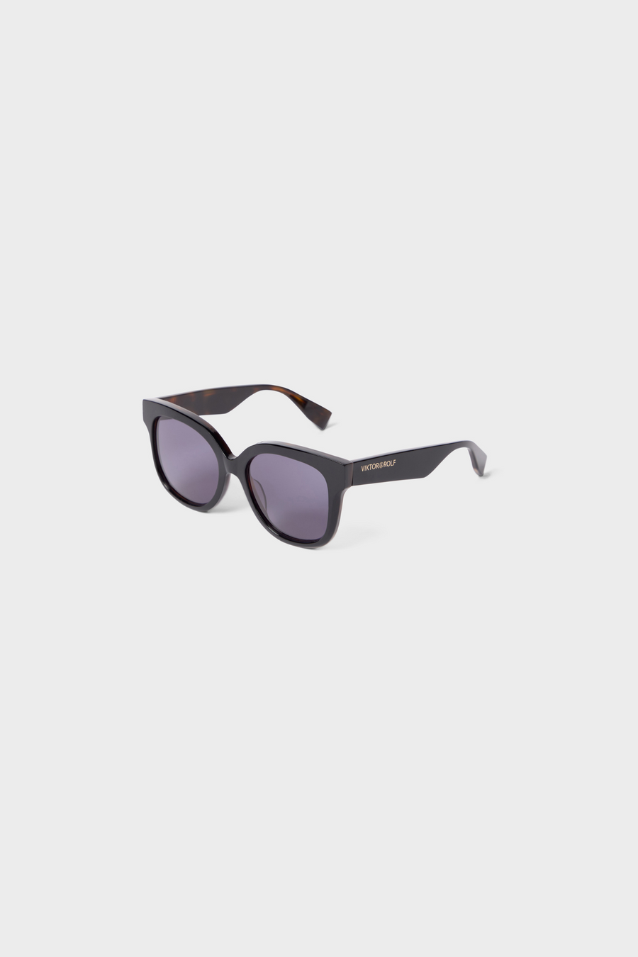 Sunglasses with a brand logo on a light gray background