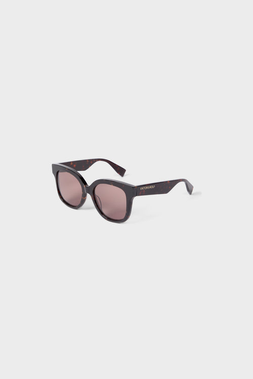 Bold tortoiseshell sunglasses featuring oversized round frames and tinted lenses, ideal for a chic, modern look.