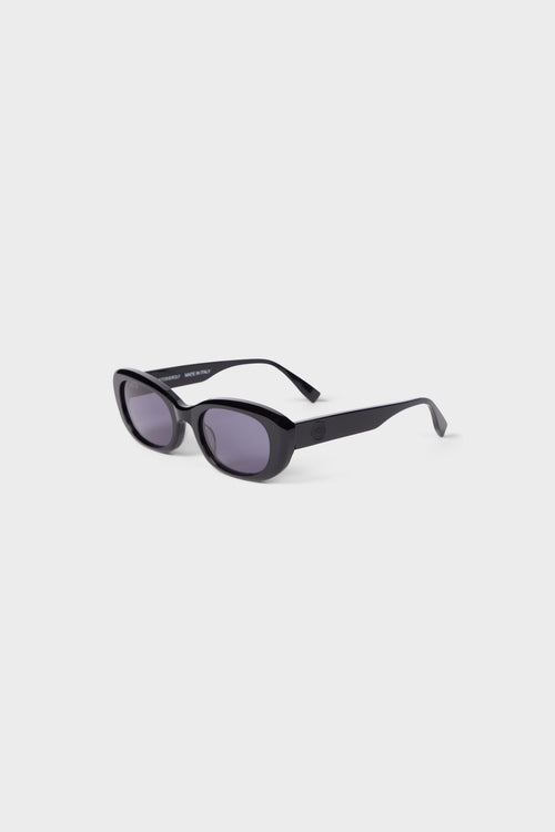 Chic black oval sunglasses with sleek acetate frame and dark lenses, exuding a modern and sophisticated look.
