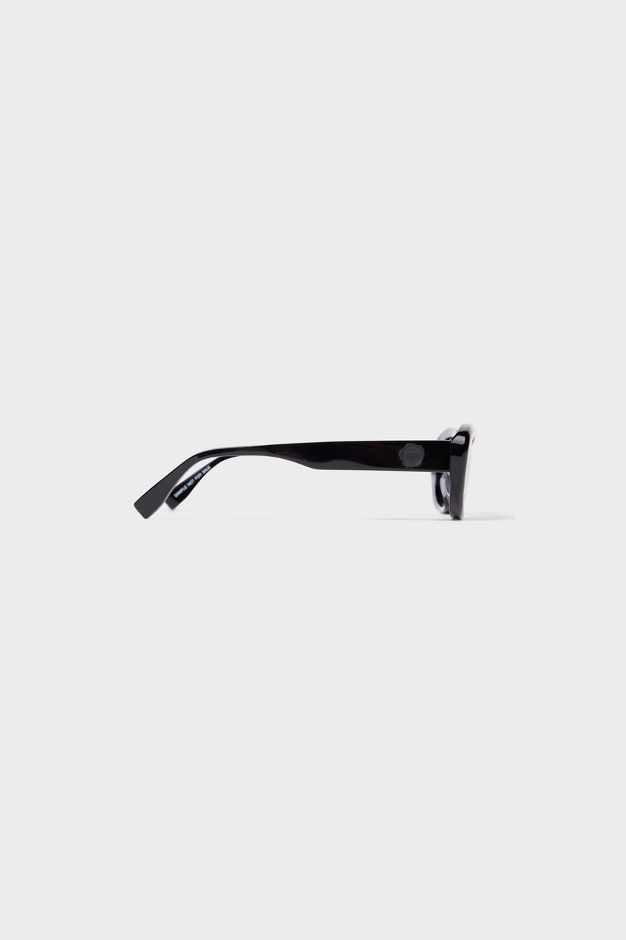 Stylish sunglasses with glossy black acetate frame.