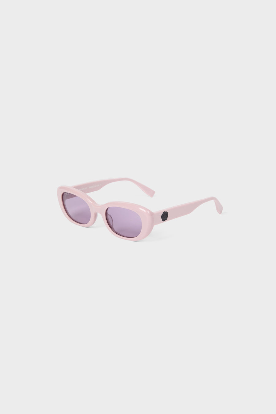 Light pink sunglasses on a white background.