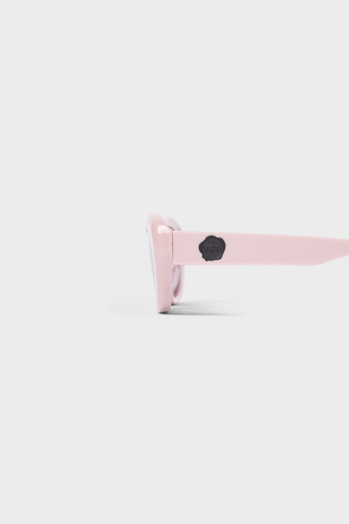 Light pink sunglasses on a white background.
