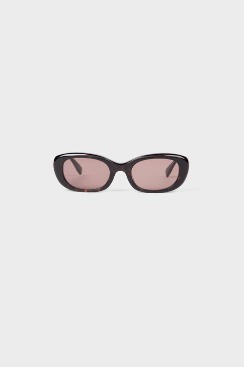 Tortoise oval sunglasses on a white background.