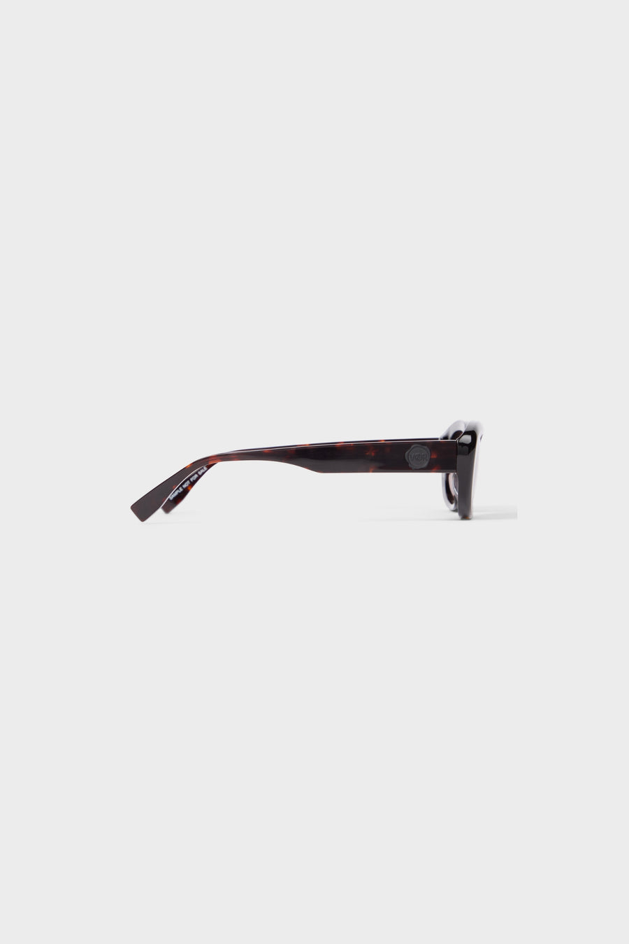 Tortoise oval sunglasses on a white background.