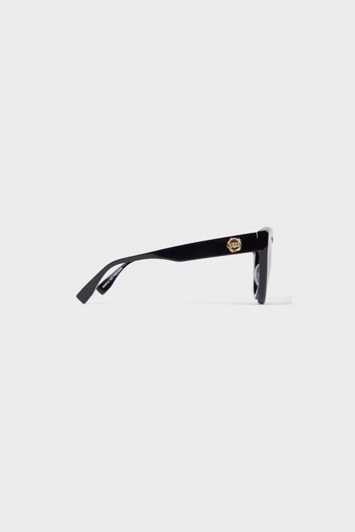 Black cat-eye sunglasses on a white background.