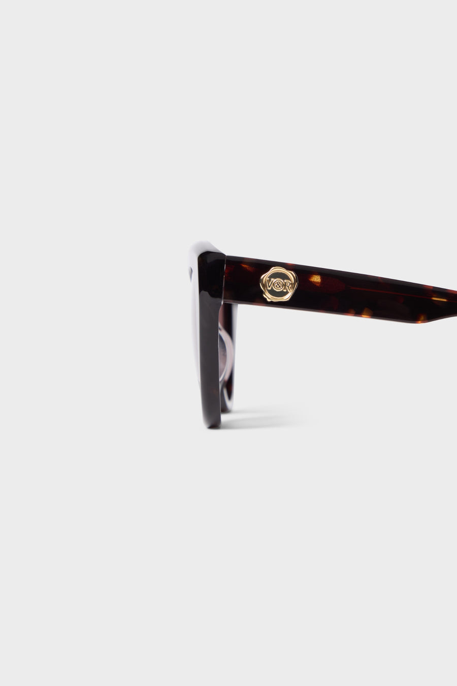 Tortoise cat-eye sunglasses on a white background.