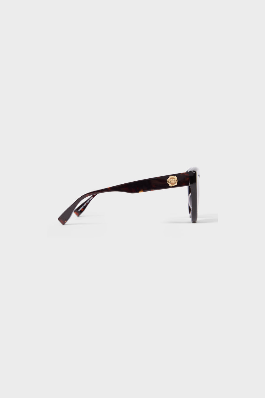 Tortoise cat-eye sunglasses on a white background.