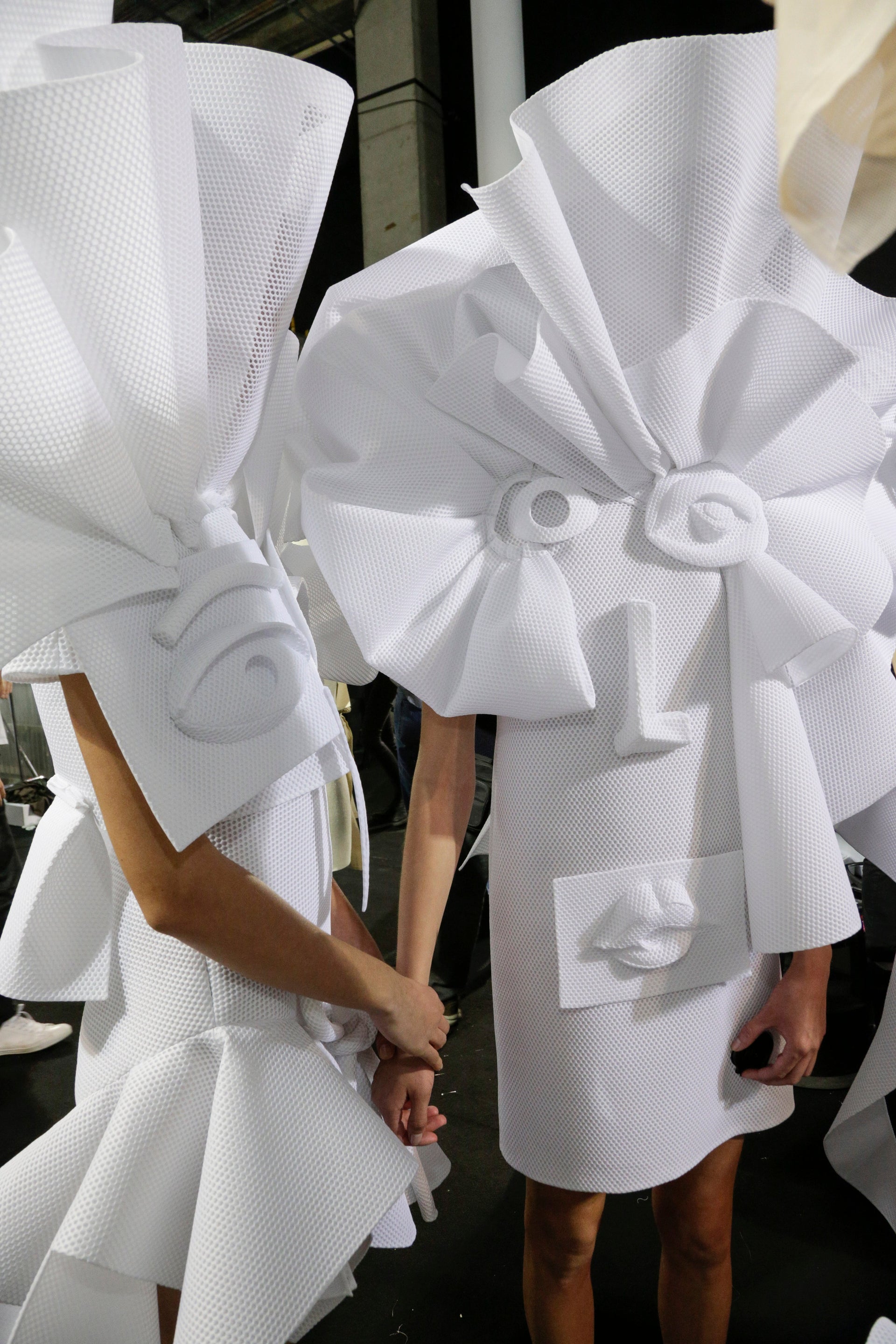 two models in white haute couture dresses