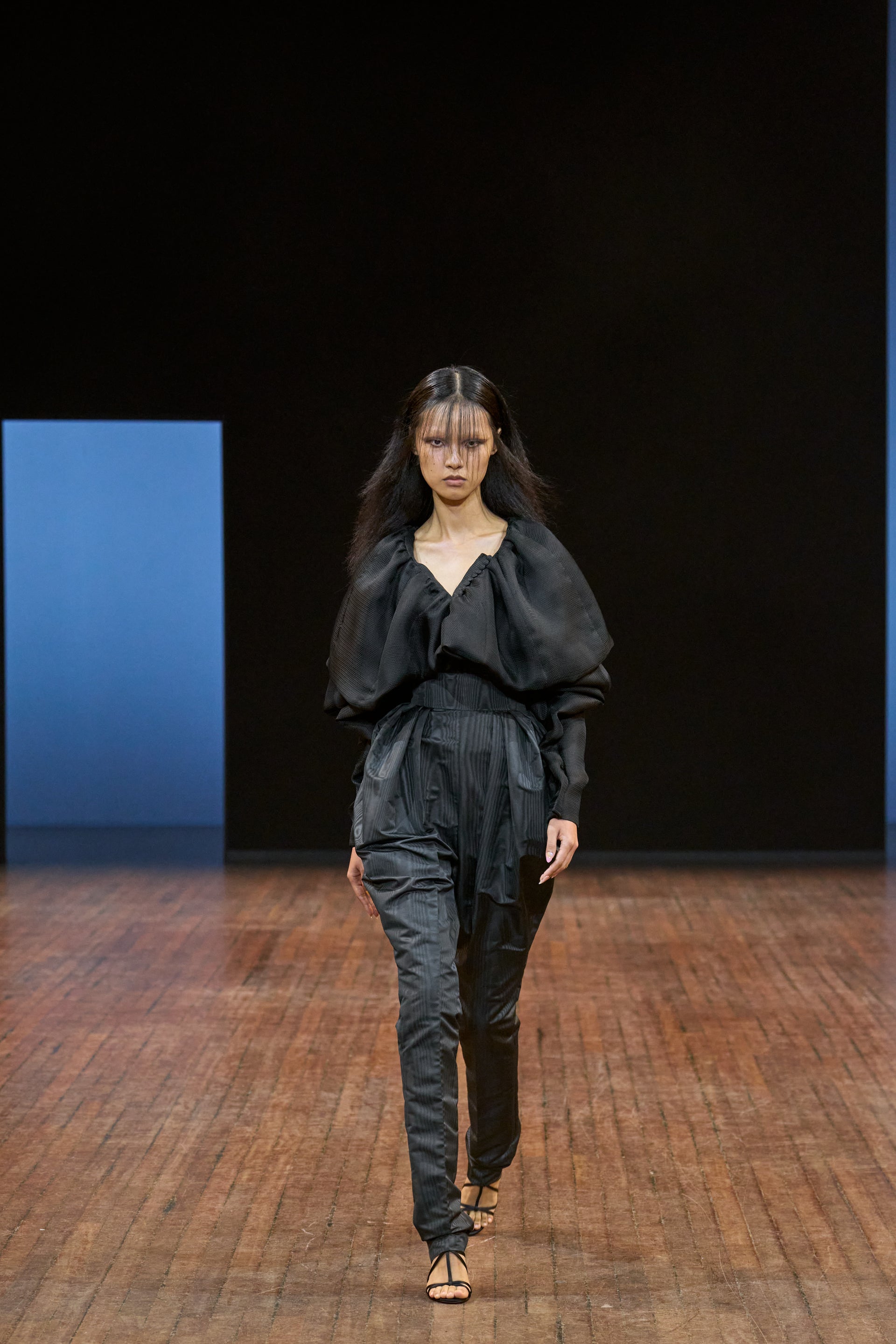 Viktor&Rolf Haute Couture Angry Birds show Autumn/Winter 2025, displaying one of the looks. The model is wearing a feather featured gown.