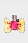 Perfume bottle with a colorful design on a light gray background