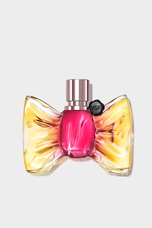 Perfume bottle with a colorful design on a light gray background