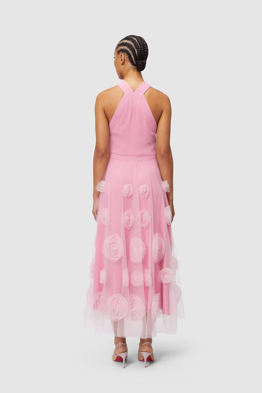 Pink sleeveless dress adorned with 3D floral tulle appliqués, featuring an elegantly layered A-line silhouette.
