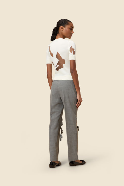 The laser cut hemlines and pleated japanese bonded satin embrace vitkor&rolf's scissorhands signature details in a dress