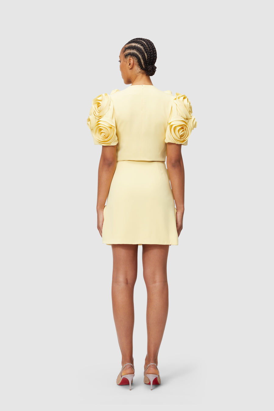 Elegant yellow dress with striking floral applique sleeves, tailored fit, perfect for stylish, modern fashion statements.