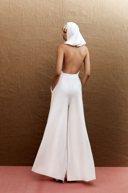 Viktor & Rolf Mariage Bridalwear Collection, Statement Kylie jumpsuit, minimalist backless design with elegant drape.