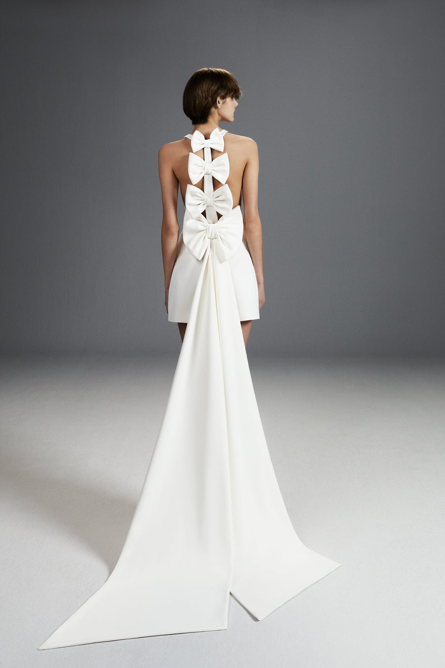 Viktor & Rolf Mariage Bridalwear Collection Dreamy bow romper with sculptural white bows and elegant train design
