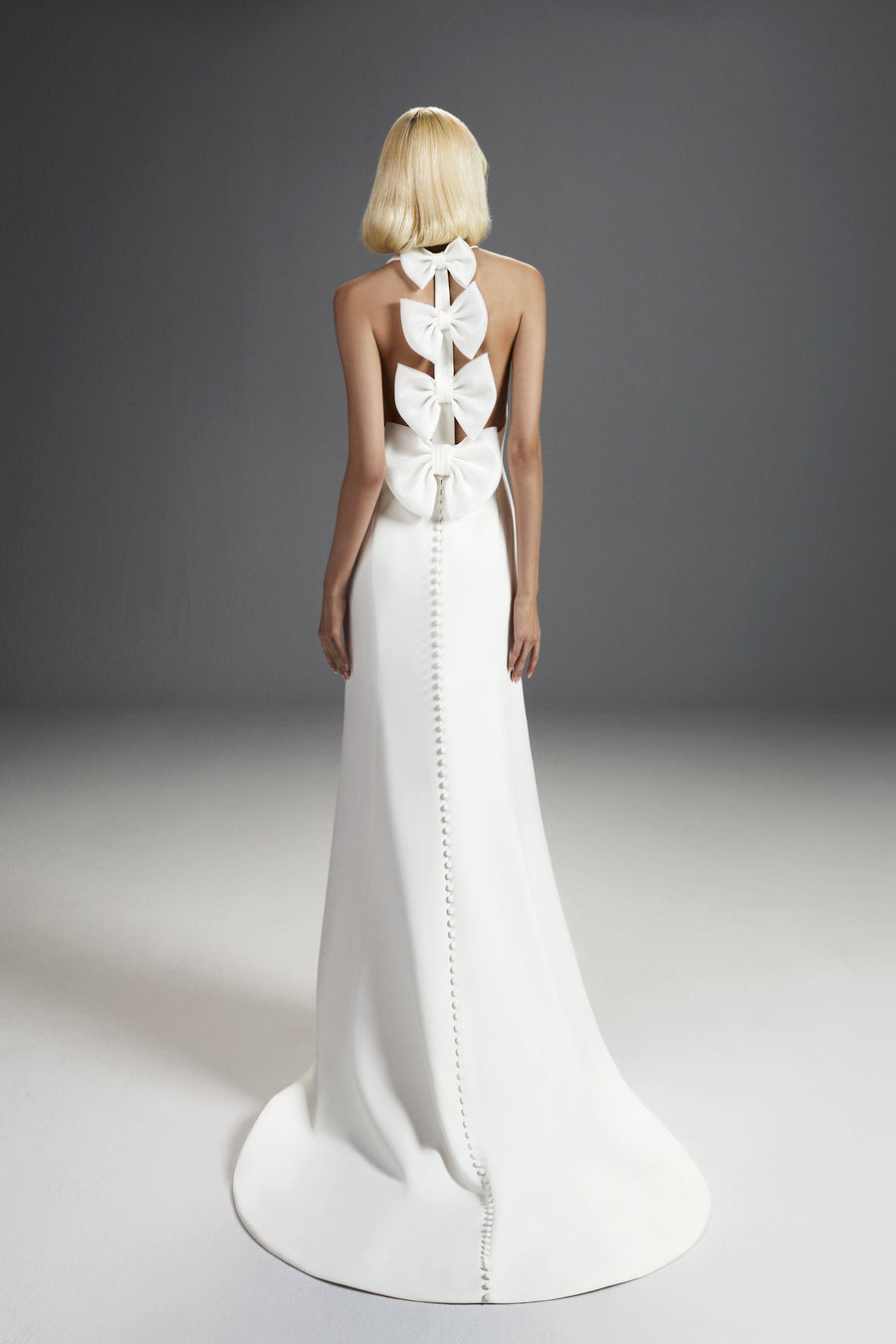 Elegant Viktor & Rolf Mariage Bridalwear Collection gown, Dreamy Bow Mermaid design with sculptural bows and couture details.