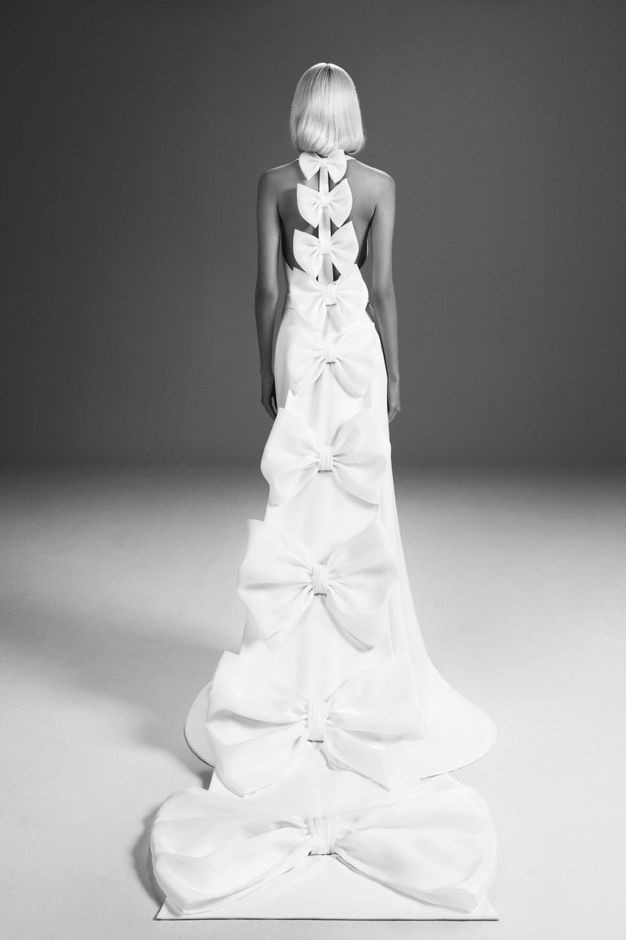 Viktor & Rolf Mariage Bridalwear Collection Dreamy Bow Mermaid gown with cascading bows and elegant silhouette.