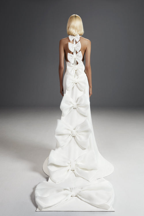Viktor & Rolf Mariage Bridalwear Collection 'Dreamy Bow Mermaid' gown with cascading bows, elegant couture design.