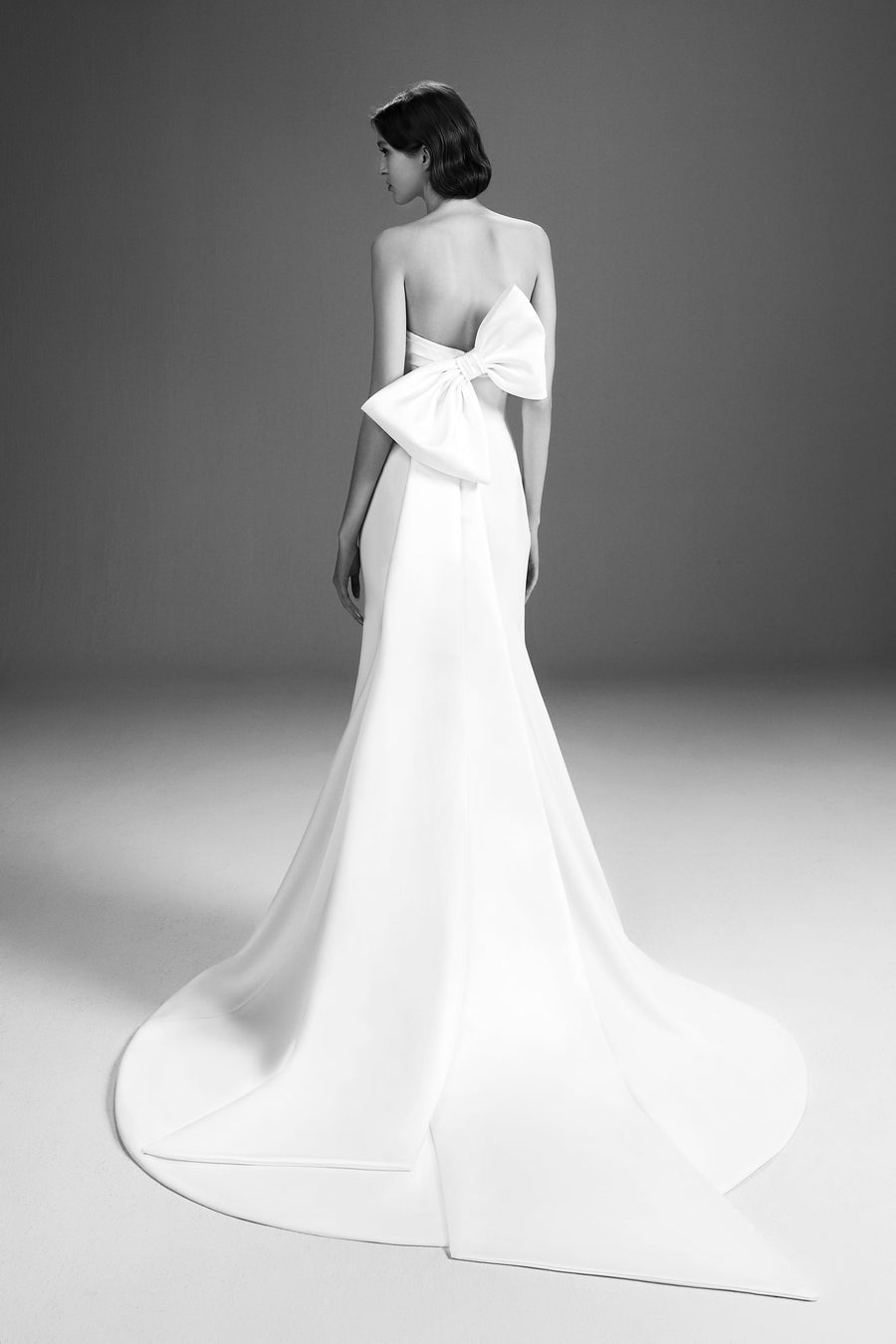Viktor & Rolf Mariage Bridalwear Collection sculpted bow gown, strapless design with elegant, flowing silhouette.
