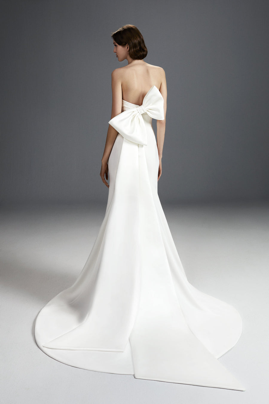 Viktor & Rolf Mariage Bridalwear Collection featuring sculpted bow gown, elegant strapless design with luxurious fabric.