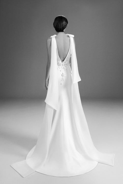 Viktor & Rolf Mariage Bridalwear Collection Fairytale Flowers gown, sleek silhouette with cascading floral embellishments.