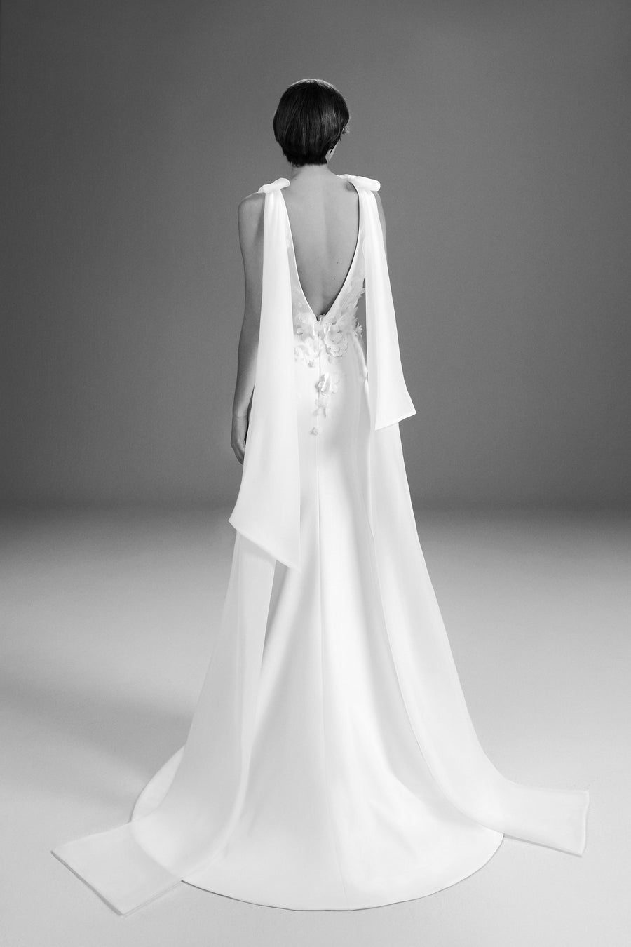Viktor & Rolf Mariage Bridalwear Collection Fairytale Flowers gown, sleek silhouette with cascading floral embellishments.