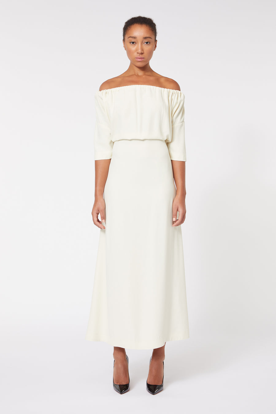 Elegant off-shoulder ivory dress with a flattering A-line silhouette, featuring three-quarter sleeves for a classic appeal.