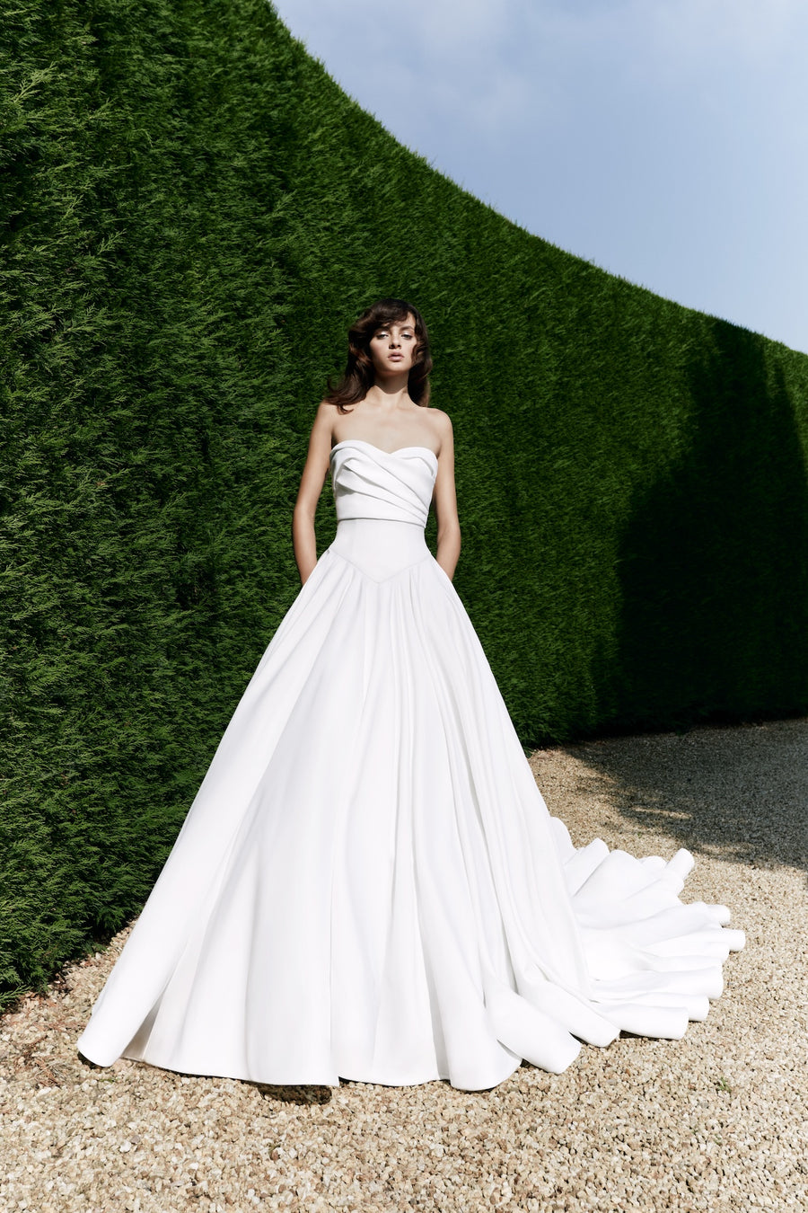 Viktor & Rolf Mariage Bridalwear Collection gown, Autumn Winter 25, strapless design, flowing skirt, elegant bridal style.