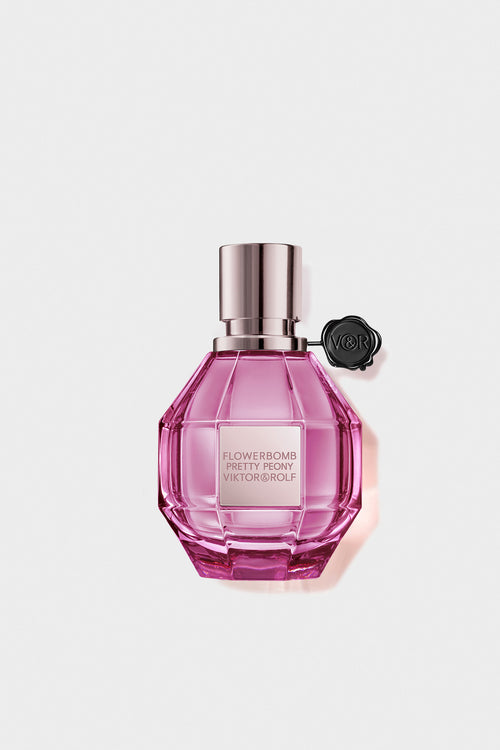 Pretty Peony flowerbomb perfume in a pink bottle on a white background.