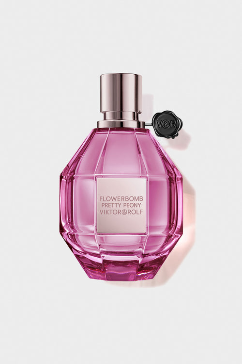 Pretty Peony flowerbomb perfume in a pink bottle on a white background.