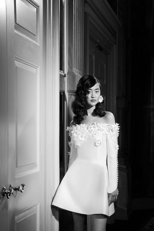 Viktor & Rolf Mariage Bridalwear Collection showcasing elegant Mini daisy dress with floral embellishments and couture design.