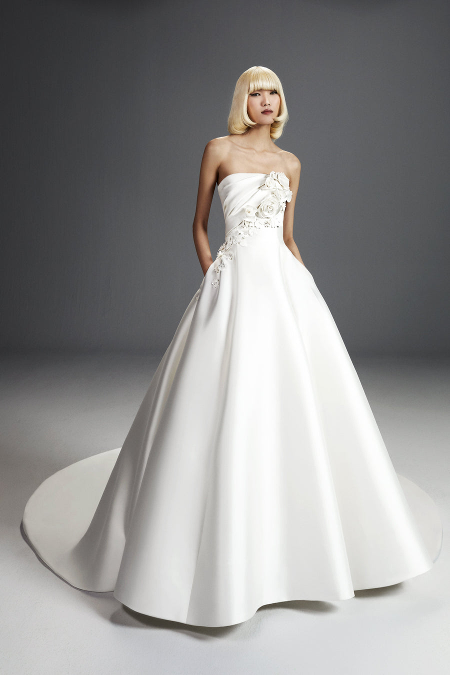 Viktor & Rolf Mariage Bridalwear Collection Flower Bouquet Gown, elegant white dress with sculptural floral details.
