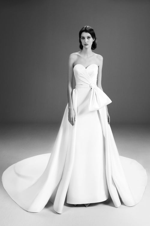 Viktor & Rolf Mariage Bridalwear Collection, Strapless dreamy bow gown, elegant white design with couture craftsmanship.