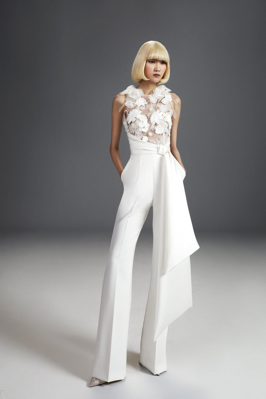 Viktor & Rolf Mariage Bridalwear Collection Fairytale flowers jumpsuit, floral elegance with tailored bow and intricate design.