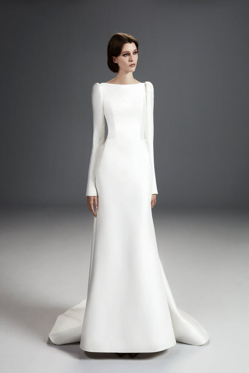 Viktor & Rolf Mariage Bridalwear Collection, Sculpted Column Gown in white, minimalist elegance with long sleeves.